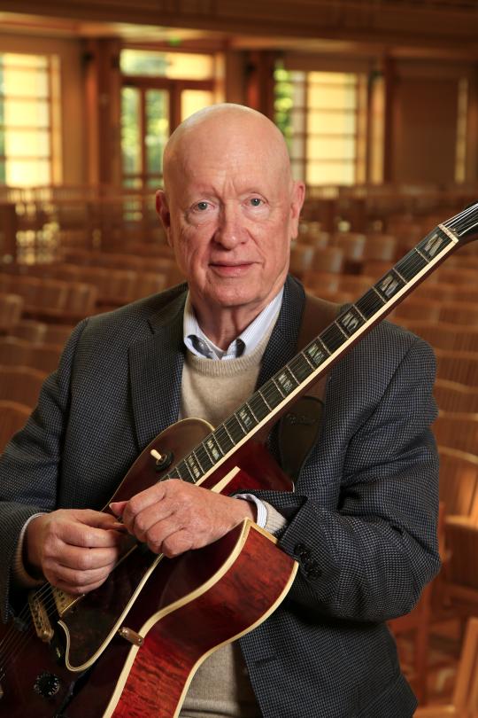 Randy Vincent headshot with guitar