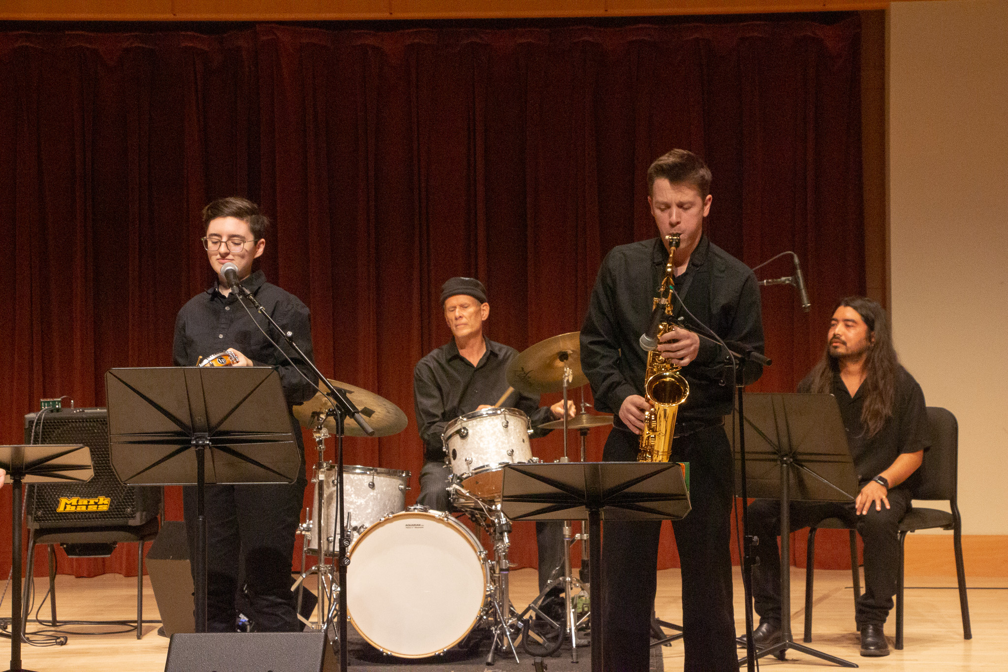 Latin Band performing on stage in Schroeder Hall