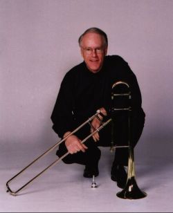 Dave Eshelman headshot with trombone