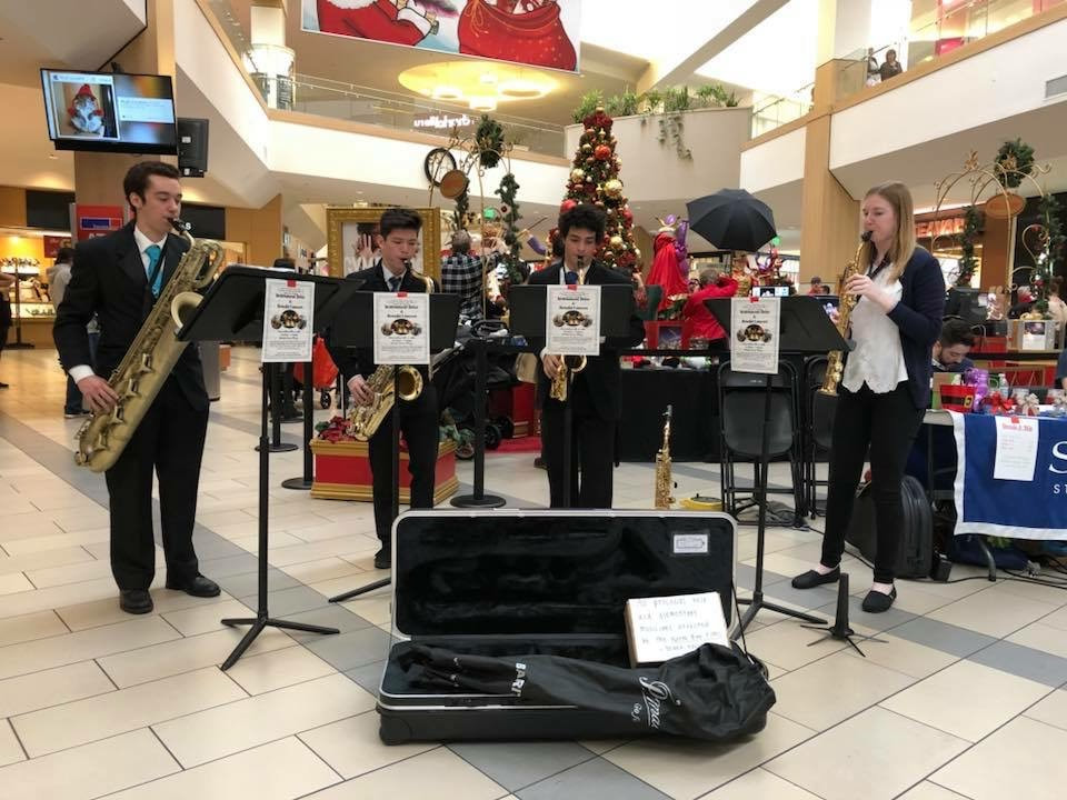 Saxophone Quartet playing in the mall during Christmas time