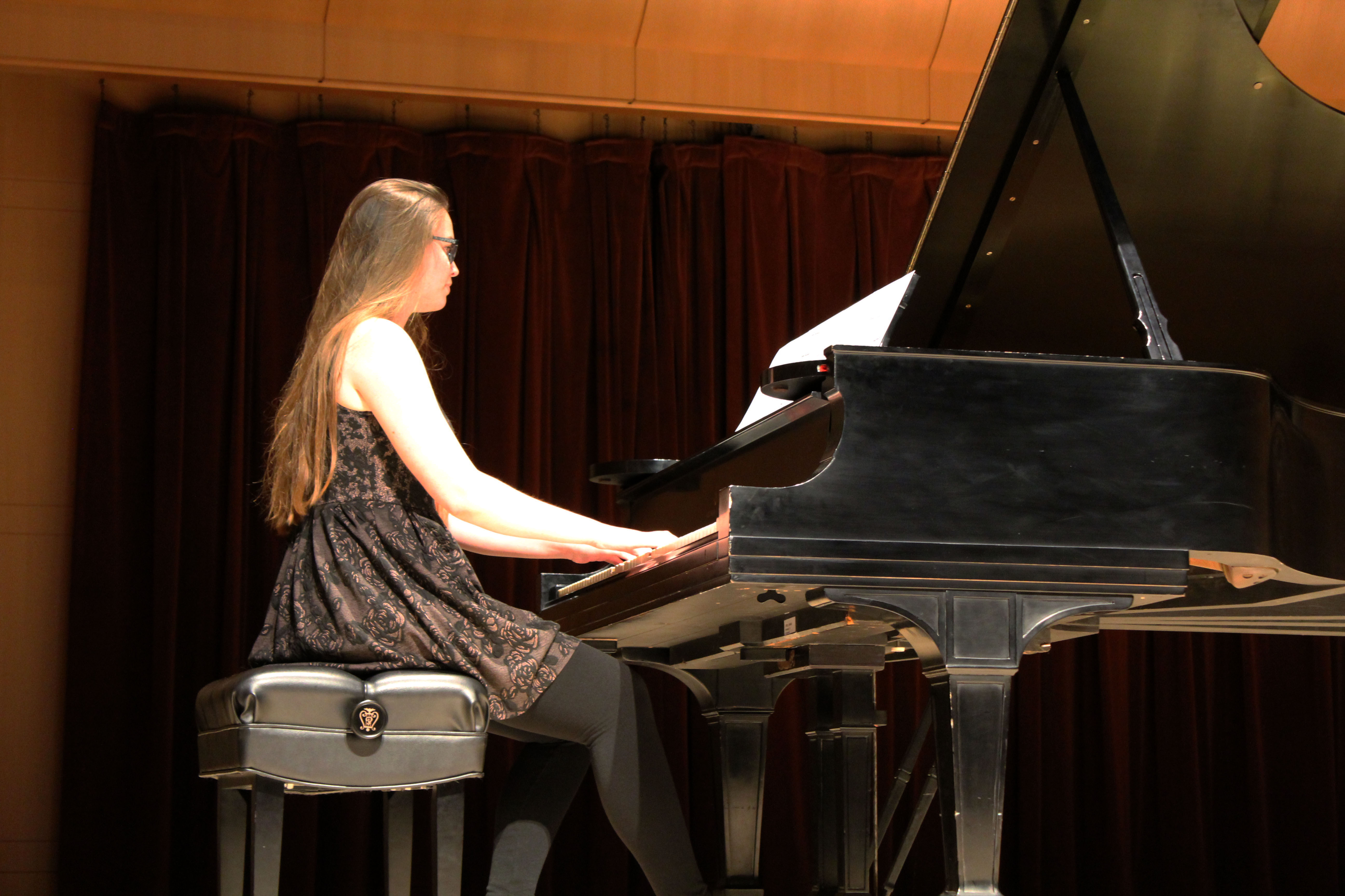 student playing the piano on Schroeder stage