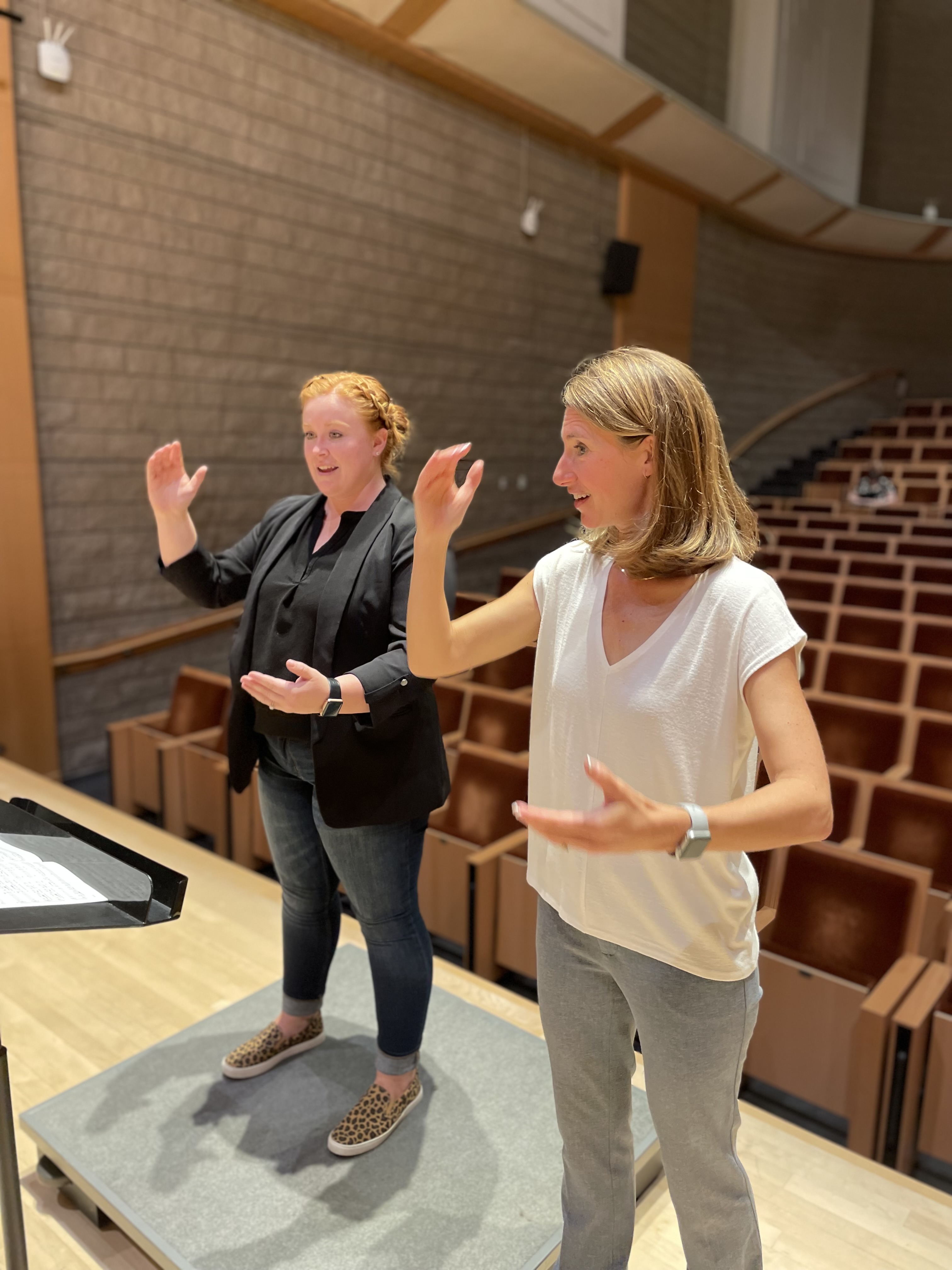 Jenny Bent instructing choral conducting student