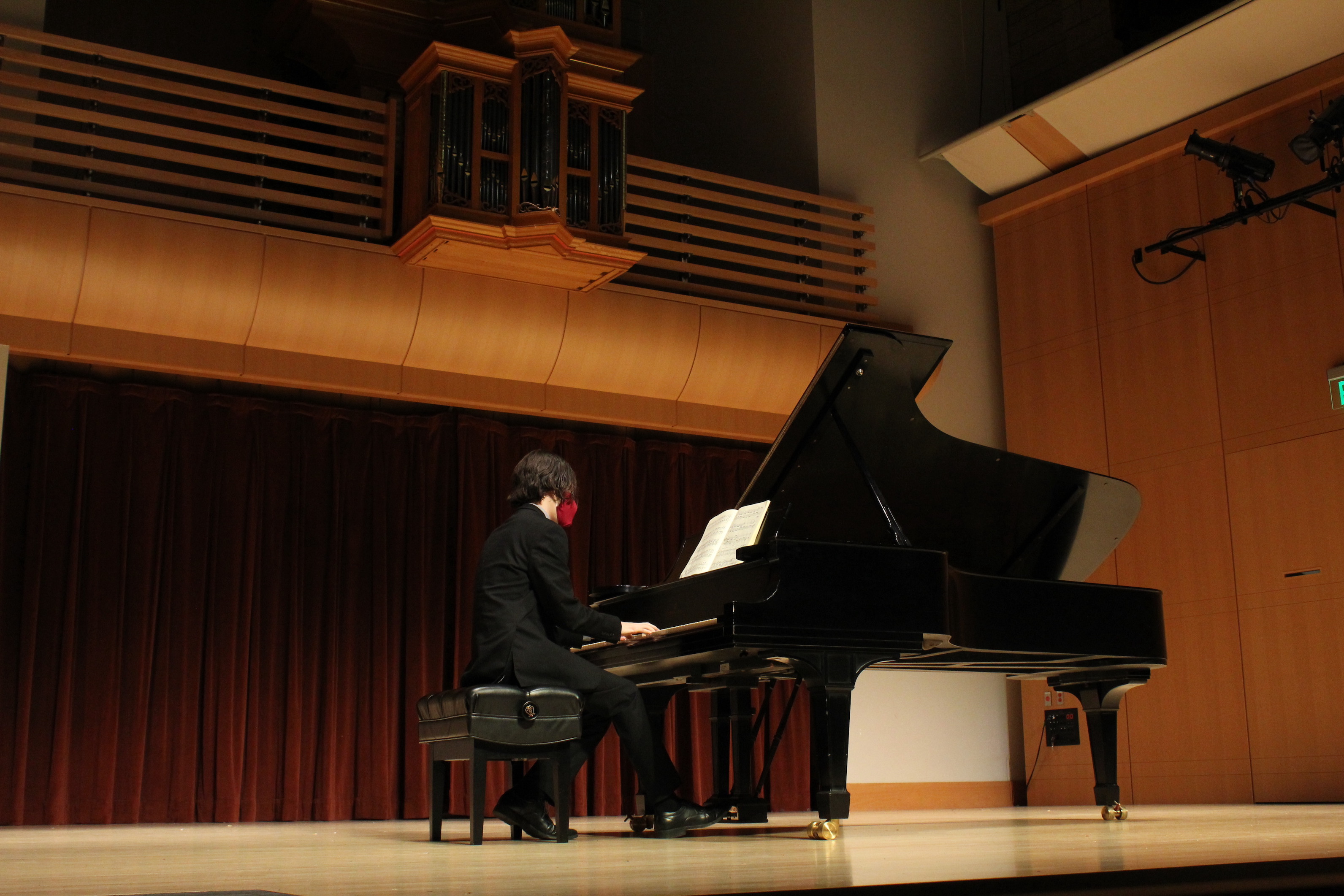 student playing piano on Schroeder stage